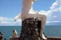 054-Statue-of-a-naked-siren-modestly-draped