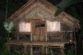 34-Kampong-hut-with-Shadow-Puppets-Wayang-Kulit-visible-in-windows